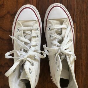 Women’s white Converse high top sneakers